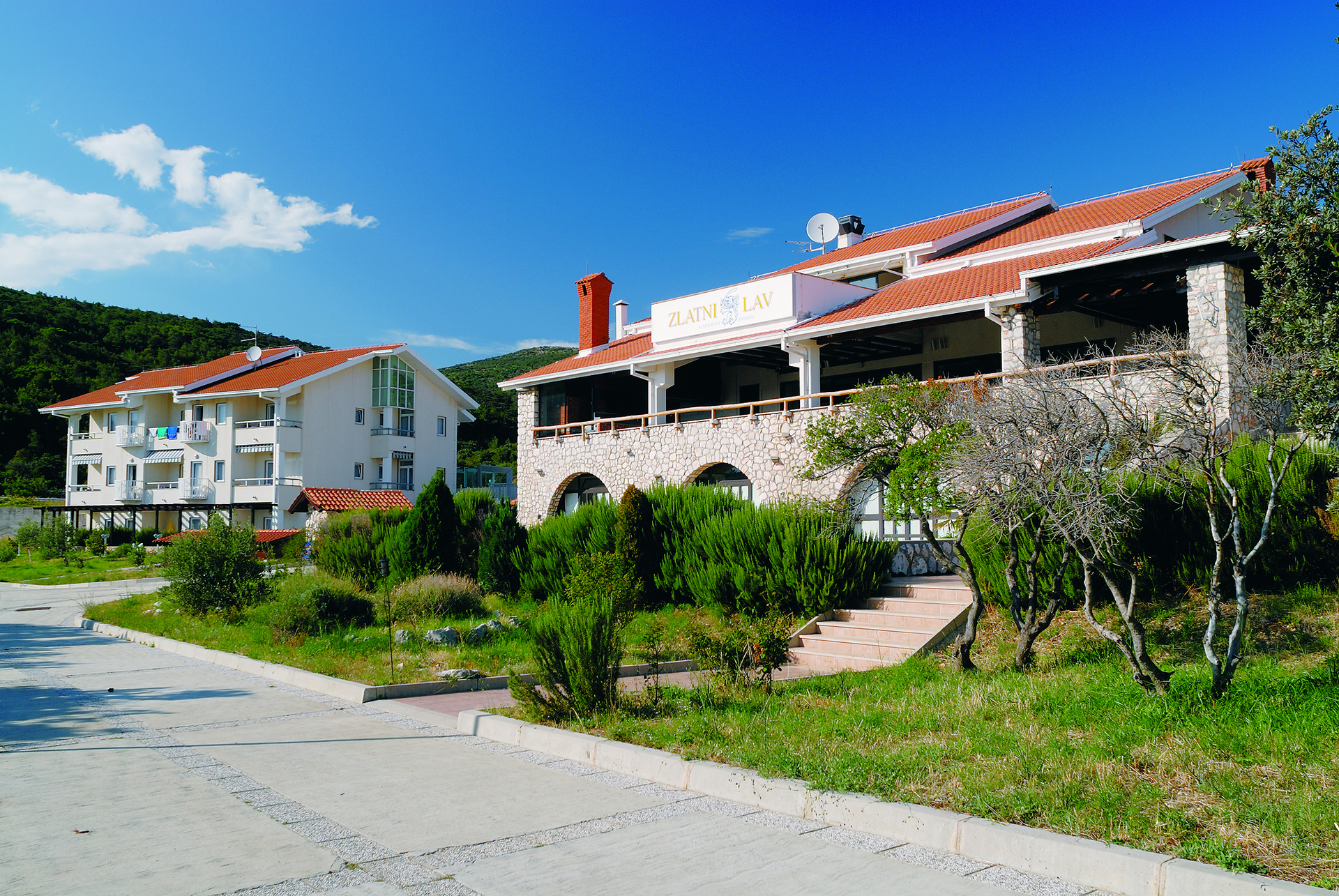 Hotel Zlatni Lav and its restaurant building in Martinšćica